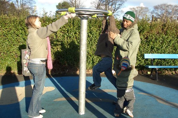 Catherine and Deji prepare to send Sam for a spin.