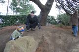 Climbing a mound of dirt.